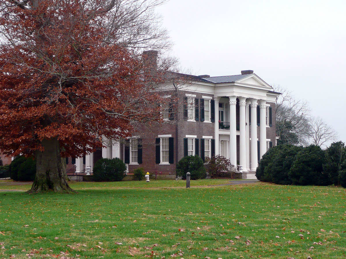 Rippavilla, a two-story red-brick antebellum house with a white four-column portico, seen across a wide lawn